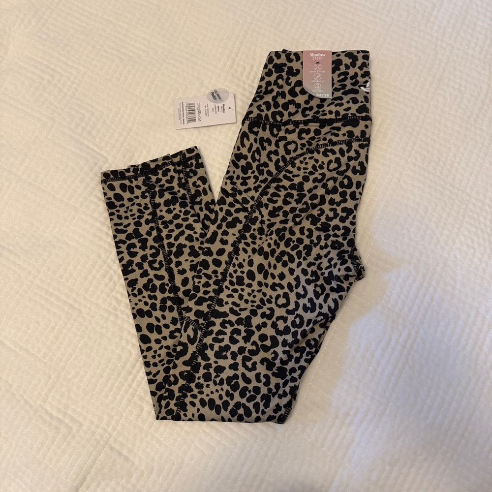 NWT. Animal print workout leggings with cellphone pocket.